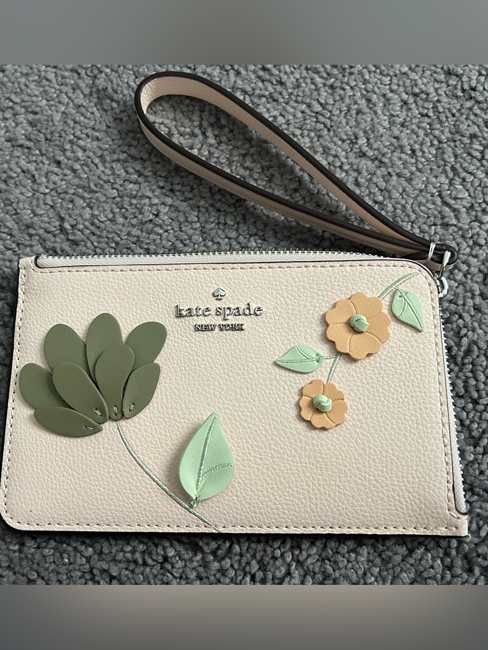 kate spade cream floral wristlet with green and tan appliqués (NEW no tags)